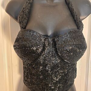 Ready for a night out in this Match Ups Black Bustier Sequin Halter Crop Top